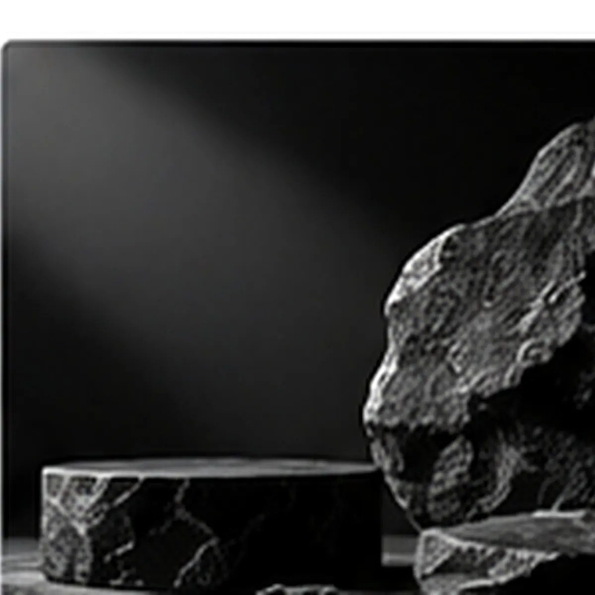 Dark black stone product pedestal with dramatic shadows and textured rock background
